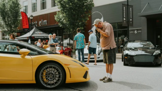 Professional car photographer taking a shot of a modified vehicle featuring a personalised show plate